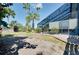 Backyard featuring tropical landscaping, screened in pool, and well-maintained lawn at 610 Alligator Dr, Venice, FL 34293