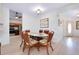 Dining room with a table that is located next to the kitchen and features seating for six and views of entryway at 610 Alligator Dr, Venice, FL 34293