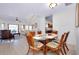 Open-concept dining area with spiral staircase connects to a living room; great for entertaining and Gathering gatherings at 610 Alligator Dr, Venice, FL 34293