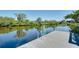 Dock with ladder offers direct access to the canal for swimming or boating at 610 Alligator Dr, Venice, FL 34293