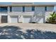 Three-car garage with driveway and charming home exterior, perfect for families at 610 Alligator Dr, Venice, FL 34293
