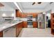 Modern kitchen with stainless steel appliances and marble countertops at 610 Alligator Dr, Venice, FL 34293