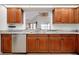 Modern kitchen with stainless steel appliances and marble countertops at 610 Alligator Dr, Venice, FL 34293