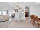 Open-concept living space featuring a spiral staircase connecting living, dining, and kitchen areas for seamless living at 610 Alligator Dr, Venice, FL 34293