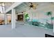 Lower level patio with bar, steps to upper level and painted mural at 610 Alligator Dr, Venice, FL 34293