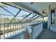 Enclosed patio area with pool view and exterior fan at 610 Alligator Dr, Venice, FL 34293
