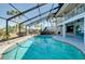 Large pool area with spa and tropical landscaping at 610 Alligator Dr, Venice, FL 34293