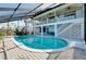 Large pool area with multi-level patio and muraled wall at 610 Alligator Dr, Venice, FL 34293