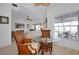 Cozy sitting area with a decorative glass table, wicker chairs, and bright natural light at 610 Alligator Dr, Venice, FL 34293