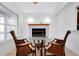 Cozy sitting area with a decorative fireplace and bright natural light at 610 Alligator Dr, Venice, FL 34293