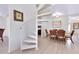 Bright living space features a spiral staircase connecting living, dining, and kitchen areas for seamless living at 610 Alligator Dr, Venice, FL 34293