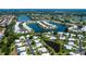 Expansive aerial view showcasing waterfront homes and lush landscaping at 611 Paget Dr, Venice, FL 34293
