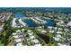 Stunning aerial view of a residential community with lakes, lush landscaping, and well-maintained homes at 611 Paget Dr, Venice, FL 34293