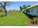 Spacious backyard with lush greenery and a serene pond view, perfect for outdoor enjoyment at 611 Paget Dr, Venice, FL 34293