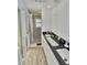 Modern bathroom with granite countertop, double sinks, and walk-in shower at 611 Paget Dr, Venice, FL 34293