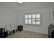 Bright room with wood-look flooring, plantation shutters, and classic decor at 611 Paget Dr, Venice, FL 34293