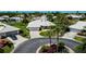 Charming home with a well-manicured lawn, driveway, and beautiful landscaping at 611 Paget Dr, Venice, FL 34293