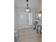 Inviting foyer with wood-look flooring, stylish decor, and a front door with sidelight at 611 Paget Dr, Venice, FL 34293