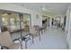 Enclosed patio with seating area and views into the bedroom and kitchen at 611 Paget Dr, Venice, FL 34293