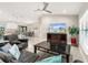 Spacious living room featuring tile floors, a ceiling fan and recessed lighting at 6126 Spinnaker Blvd, Englewood, FL 34224