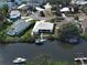 Aerial view of home featuring a tile roof, private boat dock, and waterfront access at 617 Bonito Ave, Nokomis, FL 34275