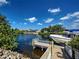 Backyard with a private dock with boat, and water views at 617 Bonito Ave, Nokomis, FL 34275
