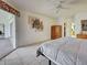 Bedroom with tile floors, bright natural light, and patio access through sliding glass doors at 617 Bonito Ave, Nokomis, FL 34275