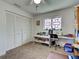Comfortable bedroom featuring a large workspace with stained glass window and ample storage at 617 Bonito Ave, Nokomis, FL 34275
