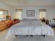 Cozy bedroom with a neutral color palette and bright natural light at 617 Bonito Ave, Nokomis, FL 34275