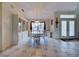 Bright dining room with elegant chandelier and large windows showcasing the outdoor view at 617 Bonito Ave, Nokomis, FL 34275