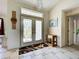 Home's entryway featuring tiled floors and decorative glass doors at 617 Bonito Ave, Nokomis, FL 34275