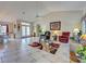 Bright and open living space with tile flooring, stylish furniture, and access to dining area at 617 Bonito Ave, Nokomis, FL 34275