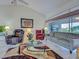 Comfortable living room featuring stylish seating and a large sliding glass door with water views at 617 Bonito Ave, Nokomis, FL 34275