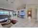 Spacious living room with large windows and open floor plan, flowing with natural light at 617 Bonito Ave, Nokomis, FL 34275