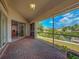 Spacious covered patio providing a serene view of the waterfront and backyard at 617 Bonito Ave, Nokomis, FL 34275