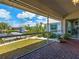 Screened-in lanai overlooking the canal, perfect for enjoying the outdoors bug-free at 617 Bonito Ave, Nokomis, FL 34275