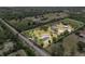 Aerial view of the estate property boundary showcasing the residence and pond at 6824 283Rd E St, Myakka City, FL 34251