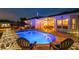 Backyard with a pool, covered patio, outdoor lighting, and recreational amenities for outdoor enjoyment at 6824 283Rd E St, Myakka City, FL 34251