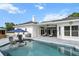 The backyard has a covered patio, an outdoor pool, and a barn for a truly unique living experience at 6824 283Rd E St, Myakka City, FL 34251