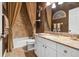The cozy bathroom offers a single vanity, toilet, and shower/tub combo behind a decorative curtain at 6824 283Rd E St, Myakka City, FL 34251