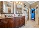Bathroom boasting dual sinks, granite counters, and an abundance of storage space at 6824 283Rd E St, Myakka City, FL 34251