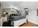 Cozy bedroom with wood floors, a full bed, and decorative wall art at 6824 283Rd E St, Myakka City, FL 34251