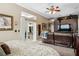Bedroom with a sofa, a sliding door to a patio, and a large entertainment center at 6824 283Rd E St, Myakka City, FL 34251