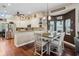 Open-concept dining area features a breakfast bar, stainless appliances and abundant natural light at 6824 283Rd E St, Myakka City, FL 34251