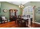 Elegant dining room with hardwood floors, chandelier, and lots of natural light at 6824 283Rd E St, Myakka City, FL 34251