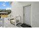 Exterior view of house with a back door and stairs leading to a quaint outdoor shower at 6824 283Rd E St, Myakka City, FL 34251