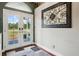 Inviting foyer featuring double French doors providing ample natural light and beautiful outdoor view at 6824 283Rd E St, Myakka City, FL 34251