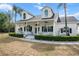 Charming front porch of this two-story home, complete with comfortable seating at 6824 283Rd E St, Myakka City, FL 34251