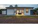 Detached garage with one bay door closed and classic car in view from open second bay, with vintage style gas pump at 6824 283Rd E St, Myakka City, FL 34251