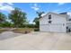 Exterior shot of white two-car garage with a star, set beneath blue skies at 6824 283Rd E St, Myakka City, FL 34251